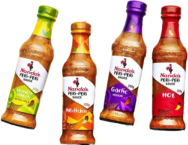 Four Nando's PERi-PERi sauce bottles: Lemon & Herb, Medium, Garlic, and Hot, showcasing vibrant labels and varying heat levels.